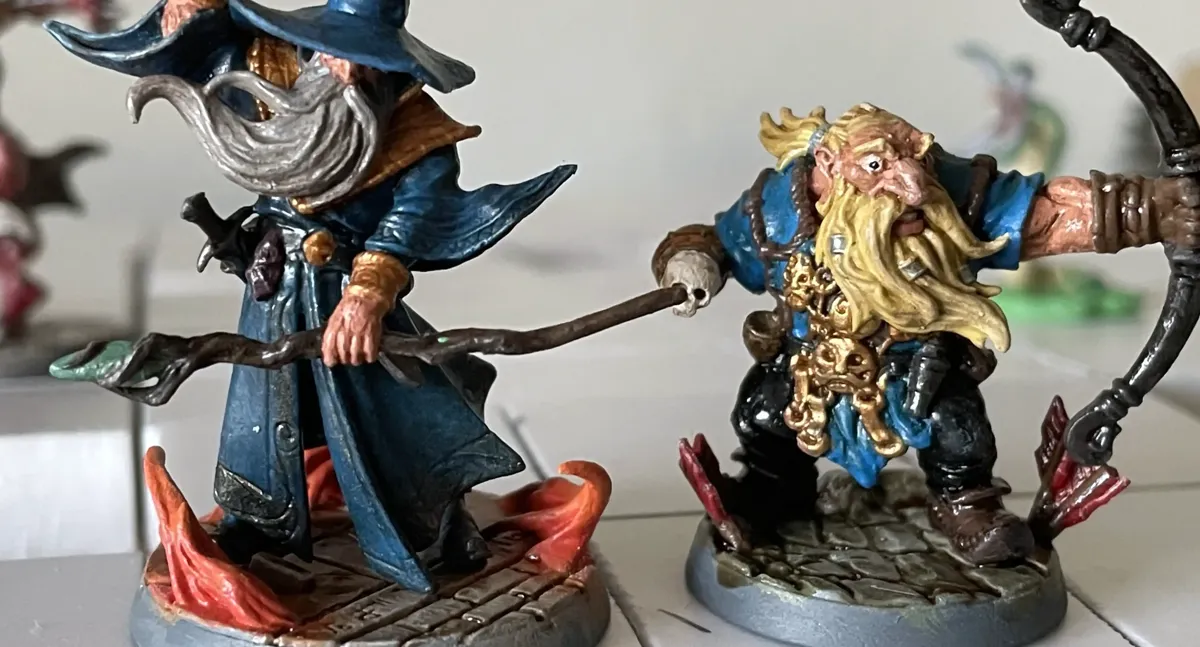 Mountain Dwarf Ranger and Human Evoker Wizard miniatures standing together
