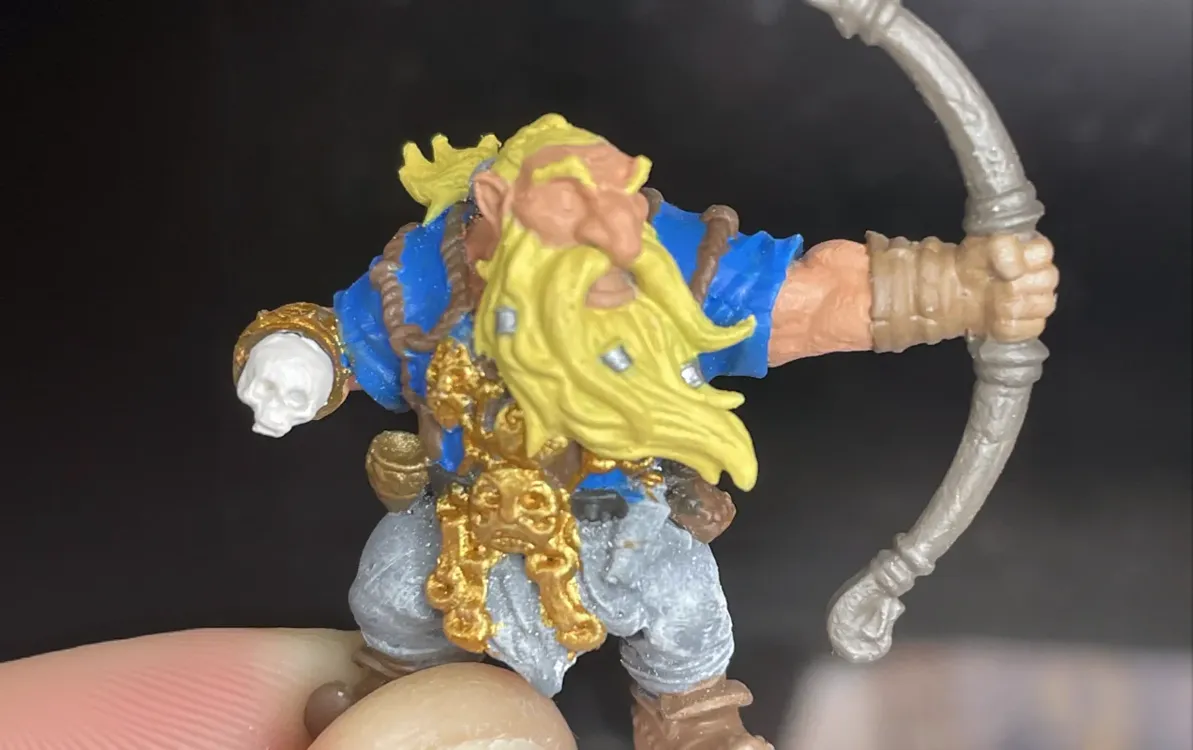 Mountain Dwarf Ranger miniature during basecoating with a skull replacing the missing hand