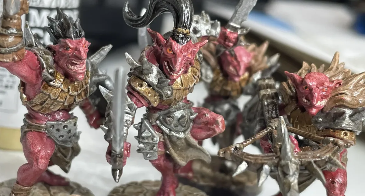 Finished Blackrazor Hobgoblin miniatures under white LED lighting